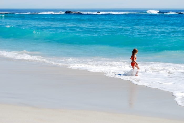 Girl playing in surf