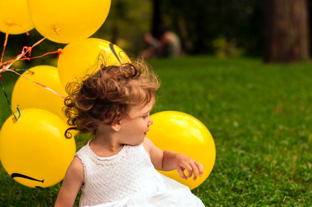 First Birthday Gift Ideas- baby playing with balloons